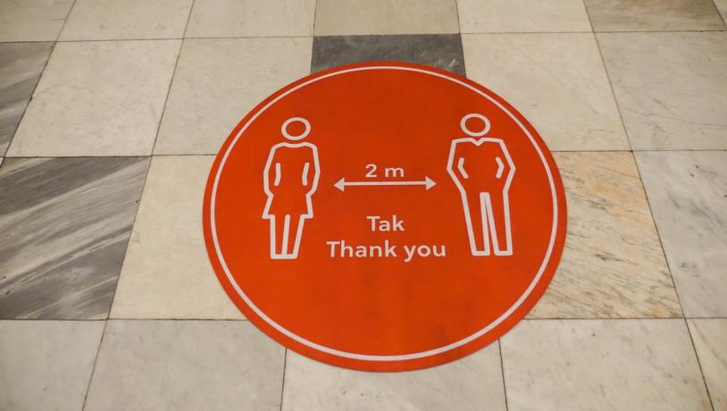 A keep your distance sticker on the floor in Denmark, to help avoid the spread of coronavirus