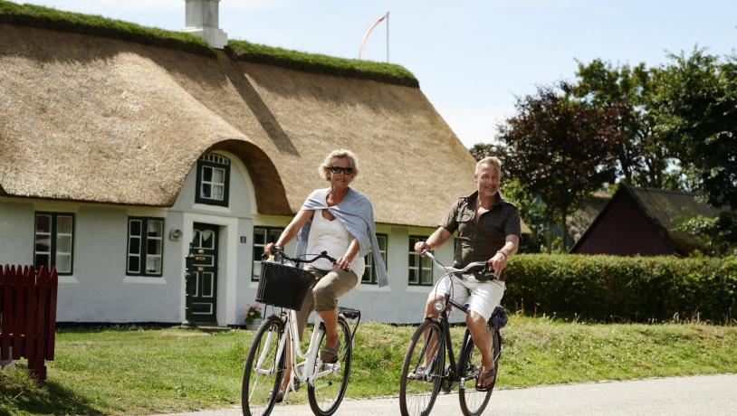 Couple cycling in Sønderho on island Fanø