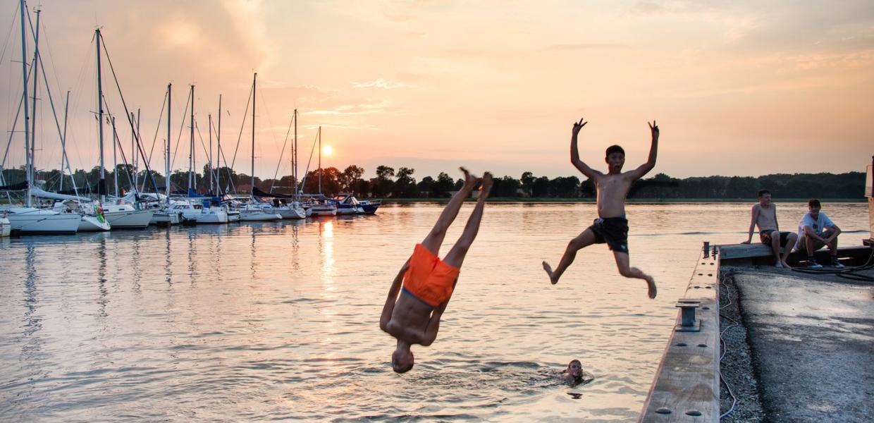 Children jumping in Water at Præstø Havn, Zealand