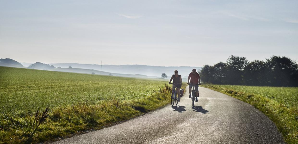 Couple biking in Djursland