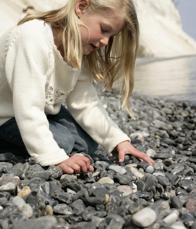 Child looking for fossils at Møns Klint, South Zealand