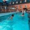 People swimming in luxury hotel Villa Copenhagen's rooftop swimming pool, Copenhagen, Denmark