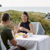 People sitting eating in holiday home in Hirtshals, North Jutland