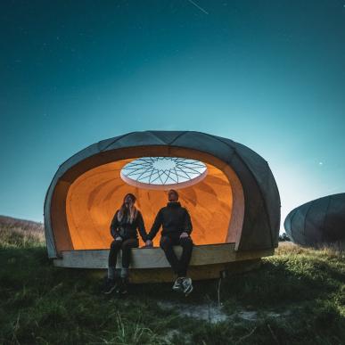 People sitting in a shelter at Brorfelde Observatory, West Zealand 