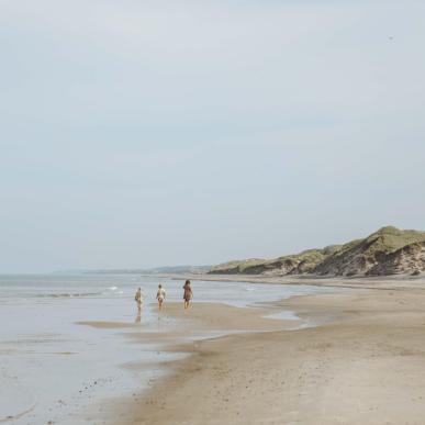 Children running on the beach on Skallerup Strand, Lønstrup